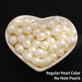 Loose creamy white ABS non-perforated pearls in heart-shaped ceramic bowl - Standard No Hole / 2mm / Pearl