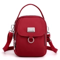 Red nylon mini crossbody bag with multiple compartments and silver-tone hardware - Burgundy