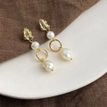 Detail of baroque pearl earrings with gold-tone hardware on a stone tray - Style 18 - Silver Earring Post