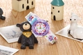 Close-up of kids waterproof quartz watch with purple cartoon insect and floral strap - Bee