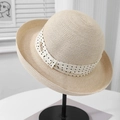 Detail of French straw hat with polka dot ribbon and gold metal charm on a hat stand - M (56-58cm) / Beige Polka Dot Upturned Wide Brim Straw Hat