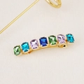 Detail view of gold alloy hair clip featuring seven colorful rectangular gemstones - Gold Colorful Square Gem / 15# Square Gem