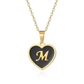Detail of gold heart pendant with black surface and golden letter M on a sleek chain - Letter M Style