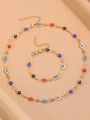 Golden Evil Eye jewelry set featuring colorful heart charms on silk background - KC Gold Evil Eye Bracelet+Necklace