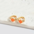 Gold star hoop earrings with vibrant orange star charms and inlaid clear gemstones - Orange