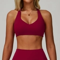 Front view of seamless V-neck sports bra in deep burgundy for high-impact fitness - S / Rose Red