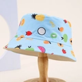 Light blue kids sun hat with colorful fruit prints on a minimal wooden stand - 54cm (3-8 Years) / Blue