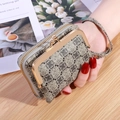 Vintage beige wallet with geometric logo print, metal clasp closure, and wrist strap - Gray