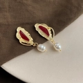Detail of baroque pearl earrings with golden leaf design and red enamel accents - Style 20 - Silver Earring Post
