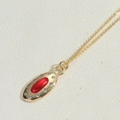 Vintage gold necklace featuring an oval red stone pendant with white zircon accents - Red