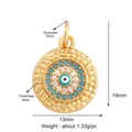 Golden Evil Eye charm pendant with hammered texture and blue crystal detailing - Turquoise