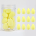 Detail of 12 yellow teardrop makeup sponges with a transparent storage jar - 12Pcs Jar Yellow