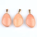 Three orange natural crystal pendants with gold edges and loops on a white background - Pink Aventurine (Single)