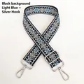 Detail of 3.8cm geometric jacquard bag strap with silver metal hooks and adjuster - Black Light Blue Silver Hook
