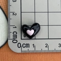 Detailed size measurement of a shiny black and pink resin heart charm on a ruler - Black Pink Double Heart Small