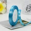 Light blue satin ribbon roll for gift wrapping and floral design with smooth silk finish - Blue