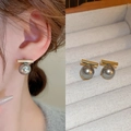Minimalist gold bar earrings with dangling dark grey round pearls on velvet display - Grey Horizontal Bar Style (20#)