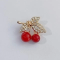 Elegant gold cherry brooch with sparkling white rhinestones and red pearl charms - Red Cherry