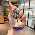 Blauwe drijfzand sleutelhanger met schattig pandafiguurtje en sterretjes glitters - Klein-Pochacco