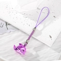 Close-up of a purple dolphin charm with woven cord and bell on a white stone texture - Bright Purple Dolphin (Alloy)