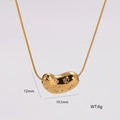 Detail of gold bean pendant with engraved letters on a polished snake bone chain - Engraved Bean Pendant Style (AML01138)