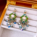 Detailed close-up of vintage gold tassel earrings with green gems and blue teardrop beads - Chameleon Tassel Vintage Style (28#)