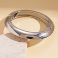 Detail of silver geometric open cuff bracelet with polished finish on textured stone - Mirror Polished / Silver-Plain