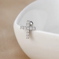 Macro detail of silver cross stud earring with zircon stones on a ceramic bowl edge - Y20412-5 Silver - Cross