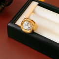 Macro shot of a vintage gold ring with a large square zircon on a luxury gift box - Gold-Clear