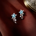 Macro shot of star-shaped silver earrings with blue stones on brown silk background - Blue Star Zirconia Ear Hook