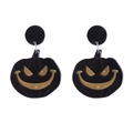 Close-up of Halloween pumpkin earrings with black and gold acrylic finish details - No.4 Black Jack-o'-lantern