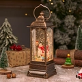 Vintage bronze Christmas lantern with snowman family and warm glowing swirling glitter - Rotating Lantern Snowman