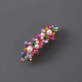 Detail of gold hair clip with colorful leaf-shaped rhinestones and white pearls - Multicolor with Gold Base