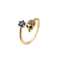 Verstellbarer Totenkopf-Ring aus Gold mit blauem Zirkonia und schwarzen Schmucksteinen - Einstellbar Offen / Gold/Blauer Zirkonia