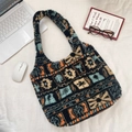 Ethnic bohemian plush tote bag with geometric patterns and checkered lining detail - Maple Leaf