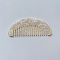 Mini marble acetate hair comb in beige tortoiseshell pattern for portable hair care - Off White