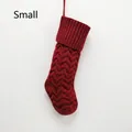 Detail of red knit Christmas stocking with wavy pattern and hanging loop in small size - Small Red