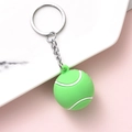 Vibrant green tennis ball keychain with white stitching on soft silicone texture - Tennis Ball