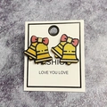 Christmas yellow bell earrings with red bows on wooden material for festive style - Christmas Bell