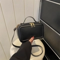 Minimalist black suitcase-style crossbody bag with gold zippers and fashion lettering - Black