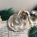 Beige open-top sun hat with wide brim and adjustable back tie on a rustic background - Sun Hat Beige