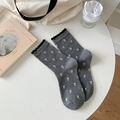 Grey crew socks with white tulip pattern and black ruffled cuffs on a cozy desk - One Size / Dark Gray