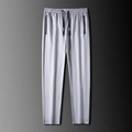Pantalones deportivos grises para hombre con cordón elástico y bolsillos con cremallera - L / Gris Claro / Pierna Recta