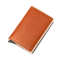 Detail of brown leather RFID card holder with visible stitching and pop-up slide mechanism - Crazy Horse Brown