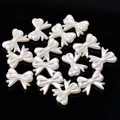 Creamy white resin bow accessories for jewelry making displayed on a black background - 6# Little Bow 14x18mm Approx 50pcs