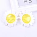 Close-up of funny white daisy flower sunglasses with yellow tinted lenses for party props - White Daisy Yellow Lens