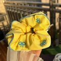 Yellow scrunchie with blue embroidery bows and contrasting blue stitched edge finish - Blue Trim Pale Yellow Scrunchie with Blue Bow