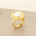 Macro shot of U-shaped gold textured ring featuring a central shell pearl inlay - US 6 / Gold U-Shaped Tiered Style (KR110922-K)