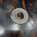 Silver-toned tennis necklace with transparent circular stones on a textured wooden base - 4mm 16inch-40cm / Silver