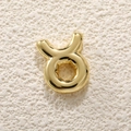 Macro shot of 18K gold plated Taurus zodiac bubble pendant for DIY jewelry making - Taurus